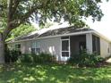 Spacious backyard featuring a screened in lanai and lush landscaping at 19232 Barred Owl Ct, Land O Lakes, FL 34638