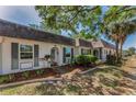 Charming single-story home showcasing decorative mulch beds, shutters, and a palm tree to enhance curb appeal at 4252 Sheldon Pl # 4252, New Port Richey, FL 34652