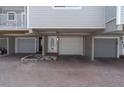 View of the garages and entry door under the elevated beach home at 12274 1St W St # 2, Treasure Island, FL 33706