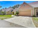 Charming single-Gathering home with a well-manicured lawn and a single-car garage in a desirable neighborhood at 3611 Pine Knot Dr, Valrico, FL 33596