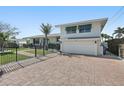 Home featuring a wide brick driveway, two-car garage, and well-maintained landscaping at 442 22Nd Se Ave, St Petersburg, FL 33705