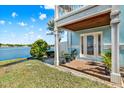Charming outdoor patio with brick flooring, lush landscaping, and a serene waterfront view at 5007 Starfish Se Dr # A, St Petersburg, FL 33705