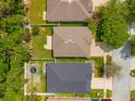 Aerial view of homes showing roof lines, backyard space, and community layout at 5902 War Admiral Dr, Wesley Chapel, FL 33544