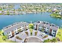 Aerial view of waterfront townhomes showcasing prime location, boat docks, and community layout at 772 Gran Kaymen Way, Apollo Beach, FL 33572