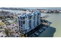 A high-angle view of a pristine waterfront condominium, featuring private boat docks, ample parking, and waterfront views at 9525 Blind Pass Rd # 508, St Pete Beach, FL 33706