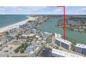 Lovely aerial view shows the property's beachside location and the intercoastal waterways at 9815 Harrell Ave # 502, Treasure Island, FL 33706