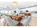Bright, open floor plan featuring a modern kitchen and dining area with ample seating at 19195 Blue Pond Dr, Lutz, FL 33558