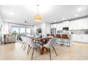 Bright, open floor plan featuring a modern kitchen and dining area with ample seating at 19195 Blue Pond Dr, Lutz, FL 33558