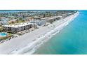 Aerial view of beachfront property with gulf views, white sand beaches, and blue water at 3210 Gulf Blvd # 108, Belleair Beach, FL 33786
