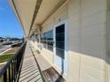Exterior view of a condo building hallway with multiple units at 4001 58Th N St # 18, Kenneth City, FL 33709