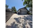 A spacious two car garage with a long driveway and partial stone facade at 824 Greenbelt Cir, Brandon, FL 33510
