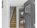 Entryway featuring tiled stairs leading up to the main living area, with tiled floors at 105 4Th Ne Ave # 219, St Petersburg, FL 33701
