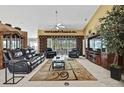 Expansive living room featuring high ceilings, comfortable seating, and ample natural light at 17364 Mediterranean Cir, Weeki Wachee, FL 34614