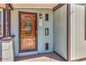 Close-up of the front door, featuring a decorative glass insert and house number at 3045 Stratford Dr, Largo, FL 33771