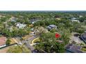 Aerial view of a home marked with a pin, located in a serene, tree-filled residential area at 5001 W Dickens Ave, Tampa, FL 33629