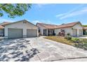 Charming single-story home with an attached two-car garage and screened lanai in a quiet neighborhood at 8206 Leafy Ct, Port Richey, FL 34668