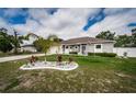 Well-kept home with manicured lawn, highlighting its inviting curb appeal and tranquil outdoor space at 11209 Kangley Ln, Spring Hill, FL 34608