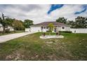 Attractive home with well-maintained lawn, featuring an inviting landscape design and a cozy atmosphere at 11209 Kangley Ln, Spring Hill, FL 34608