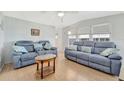 Cozy living room with comfortable seating, light wood floors and plenty of natural light at 264 S Port Royal Ln, Apollo Beach, FL 33572