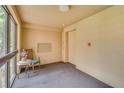 Cozy elevator lobby with a comfortable chair near the windows, providing a welcoming space for residents at 3062 Eastland Blvd # 105, Clearwater, FL 33761