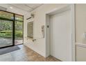 Hallway with elevator access and a mailbox, perfect for convenient living in the building at 3062 Eastland Blvd # 105, Clearwater, FL 33761