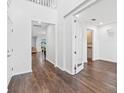 Spacious foyer with hardwood flooring and ample natural light, offering a grand entrance at 33263 Sycamore Leaf Dr, Wesley Chapel, FL 33545