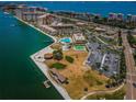 Aerial view showcasing community amenities, pristine waterfront, and lush landscaping at 4900 Brittany S Dr # 502, St Petersburg, FL 33715