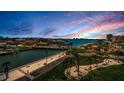 Expansive waterfront view featuring tropical landscaping, canals and picturesque sky at 4900 Brittany S Dr # 502, St Petersburg, FL 33715