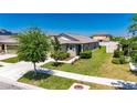 Landscaped yard with lush green lawn surrounding a charming single-story home featuring delightful curb appeal at 7236 Salt River Ave, Sun City Center, FL 33573
