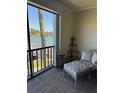 Cozy screened in lanai with a chair and corner table looking out over the intercoastal waterway at 7465 Bay Island S Dr # 211, South Pasadena, FL 33707