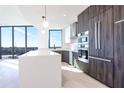 Modern kitchen with stainless steel appliances, island with counter seating, and ample storage at 777 3Rd N Ave # 1308, St Petersburg, FL 33701
