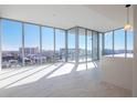Bright living room featuring floor-to-ceiling windows offering panoramic city views and lots of natural light at 777 3Rd N Ave # 1308, St Petersburg, FL 33701