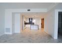 Bright and airy living room showcasing modern finishes and stunning marble floors, adjacent to the kitchen at 777 3Rd N Ave # 1501, St Petersburg, FL 33701