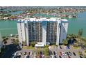 The building features multiple floors, parking, and is situated near the water at 9495 Blind Pass Rd # 308, St Pete Beach, FL 33706