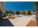 Street view showcasing a well-maintained neighborhood with manicured lawns and mature trees at 10645 Laguna Plains Dr, Riverview, FL 33578