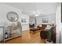 Open living room with hardwood floors, stylish decor, and ample seating at 111 Inwood Cir, Brandon, FL 33510