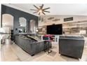 Inviting living area features stylish decor, a ceiling fan, and ample space for relaxation and entertainment at 13416 Algoma Ave, Spring Hill, FL 34609