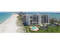 High-rise beachfront condo building features lush landscaping and sparkling swimming pool at 1460 Gulf Blvd # 1206, Clearwater Beach, FL 33767