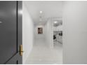 Clean, bright entryway featuring a modern design with white tile and recessed lighting at 2103 Bayshore Blvd # 1701, Tampa, FL 33606