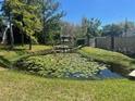 Scenic pond with lush greenery and lily pads offers a serene and tranquil setting at 2971 Estancia Blvd # 225, Clearwater, FL 33761