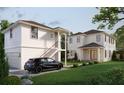 Modern home featuring a detached garage, and lush landscaping, ideal for outdoor living and entertainment at 445 36Th N Ave, St Petersburg, FL 33704