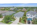 Neighborhood aerial view with lush greenery, highlighting the property's well-kept landscaping at 7338 Milestone Dr, Apollo Beach, FL 33572