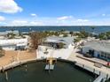 Stunning aerial view of waterfront home with private dock and boat access at 9920 Spoonbill E Rd, Bradenton, FL 34209