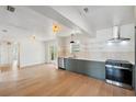 Open-concept kitchen with stainless steel appliances and ample counter space at 108 5Th St, Belleair Beach, FL 33786