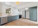 Modern kitchen with stainless steel appliances, sleek cabinets, and countertops at 108 5Th St, Belleair Beach, FL 33786