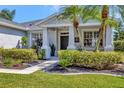 Charming front porch with well-maintained landscaping and a welcoming entrance, perfect for relaxing outdoors at 10922 Holly Cone Dr, Riverview, FL 33569