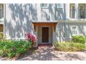Stylish front door with a decorative awning and lush landscaping enhancing the entrance at 111 S Delaware Ave # 1, Tampa, FL 33606