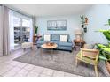 Cozy living room with waterfront views, comfortable seating, and stylish coastal decor at 159 Medallion Blvd # H, Madeira Beach, FL 33708