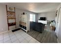 Cozy living room featuring beach decor, stylish furniture, and bright natural light at 1799 N Highland Ave # 32, Clearwater, FL 33755