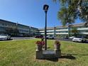 South Seas building sign with red potted plants on a sunny day at 2255 Philippine Dr # 21, Clearwater, FL 33763